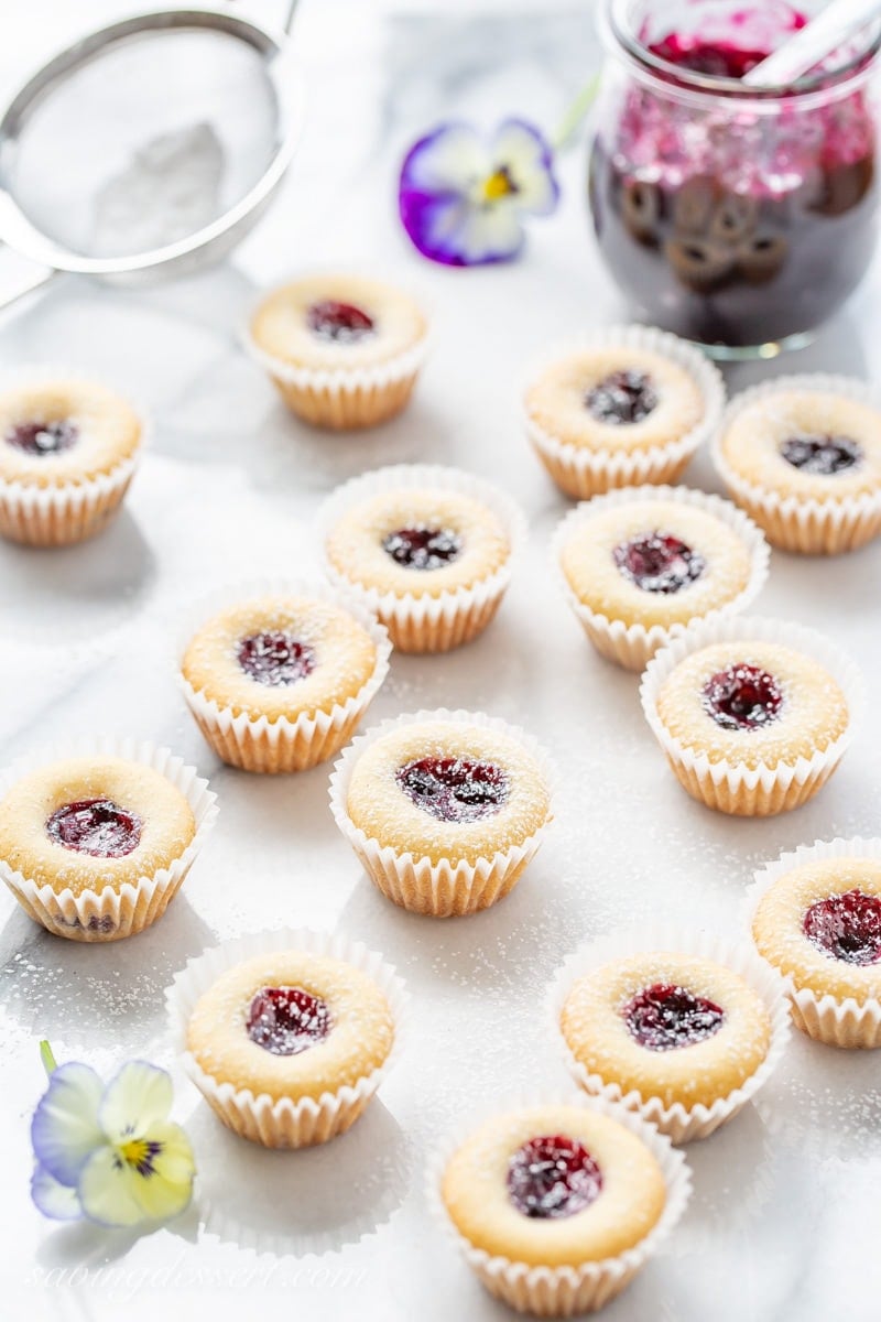 Almond Tea Cakes with wild blueberry jam dusted with powdered sugar