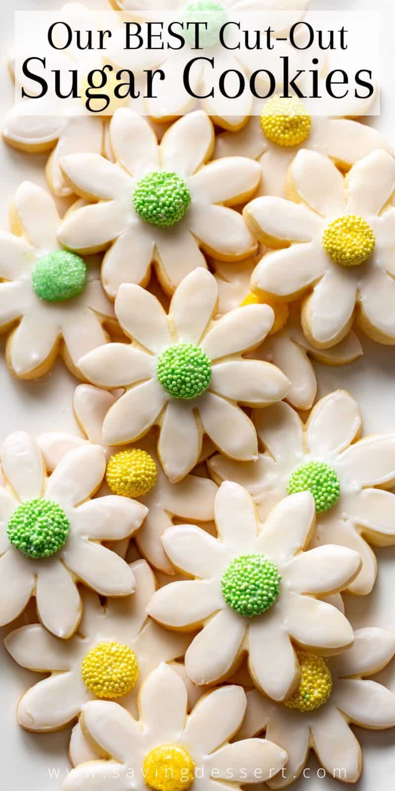 An overhead view of a platter of cut-out sugar cookies shaped like flowers
