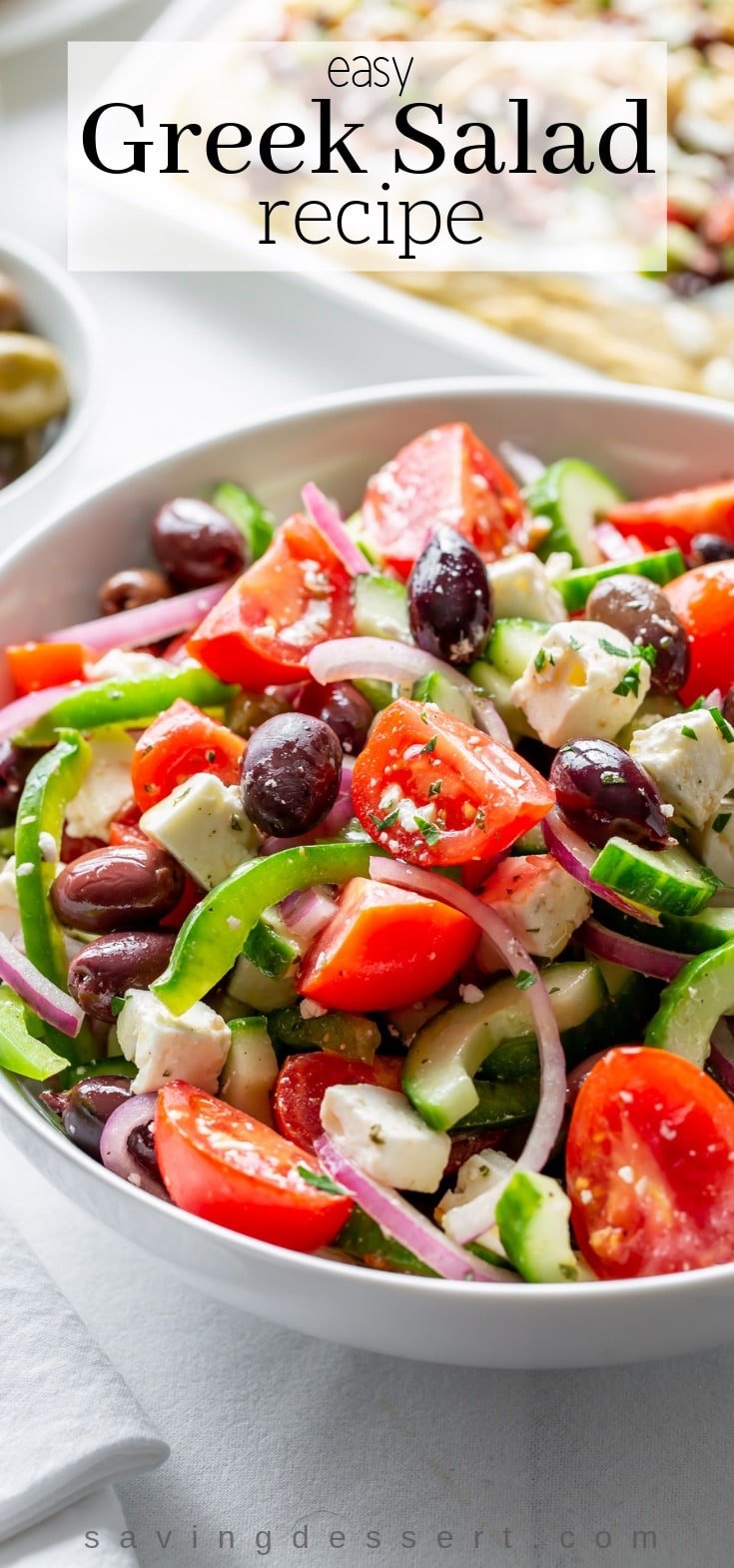 Enjoy this easy Greek Salad Recipe made with crisp, fresh vegetables, feta cheese and olives, simply dressed with herbs, oil and vinegar. #Greeksalad #Greek #easysalad #salad #Greeksaladrecipe #saladrecipe