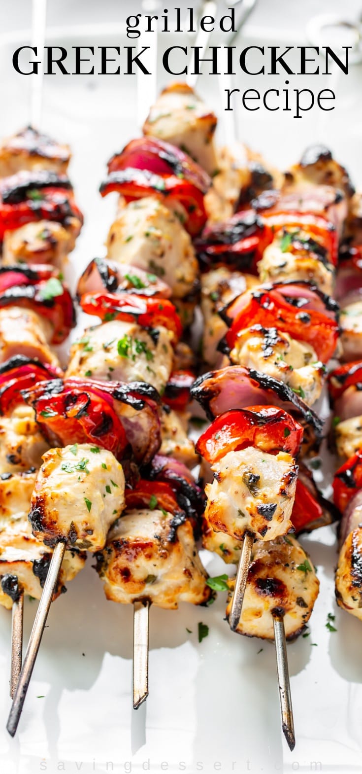 Skewers of grilled chicken with red onion and red peppers