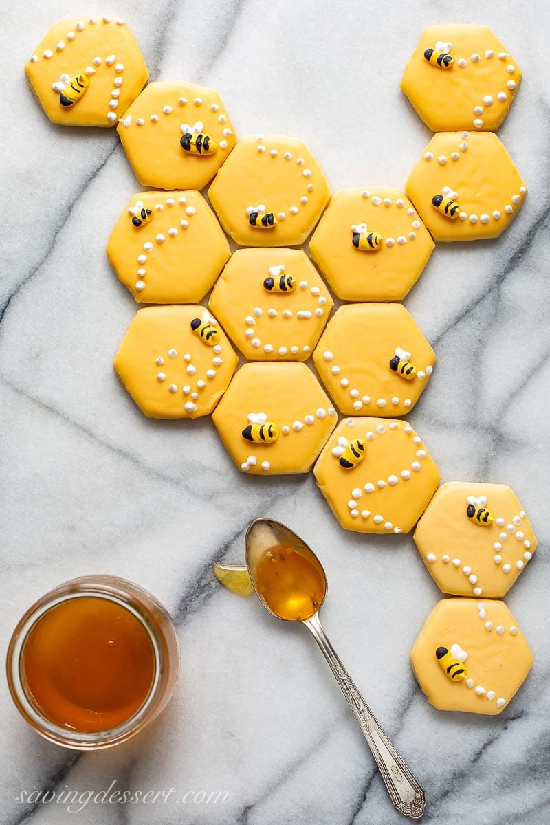 A honeycomb pattern made with a cut-out sugar cookie recipe decorated with honey bees on top