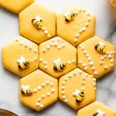 Cut out sugar cookies decorated with honey bees