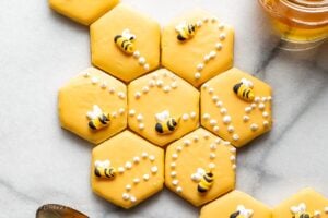 Cut out sugar cookies decorated with honey bees