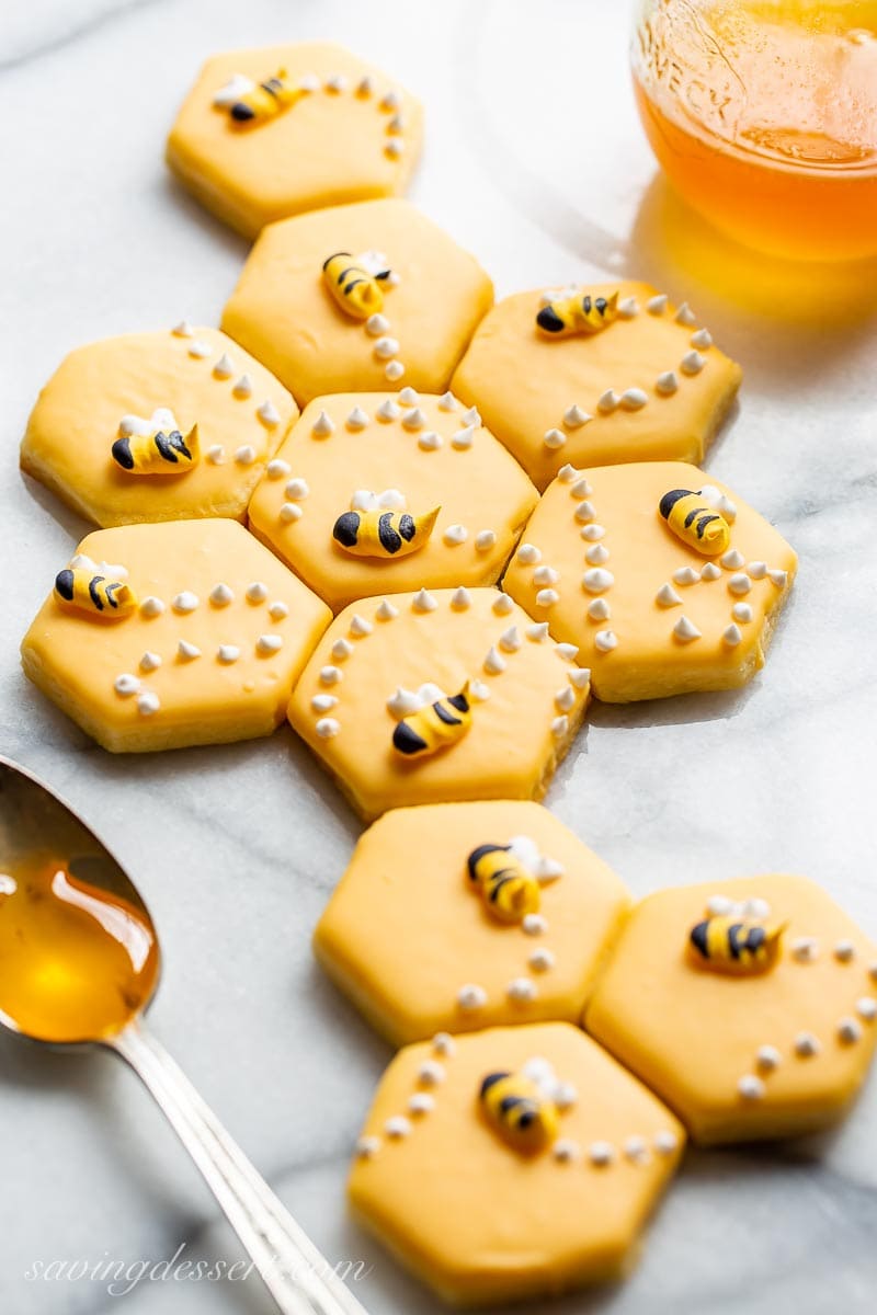 Cut-Out Sugar Cookie recipe in the shape of a bee hive, decorated with honey bees