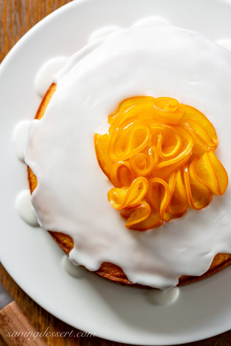 An overhead view of a Sunny Citrus Cake with a group of candied orange slices on top