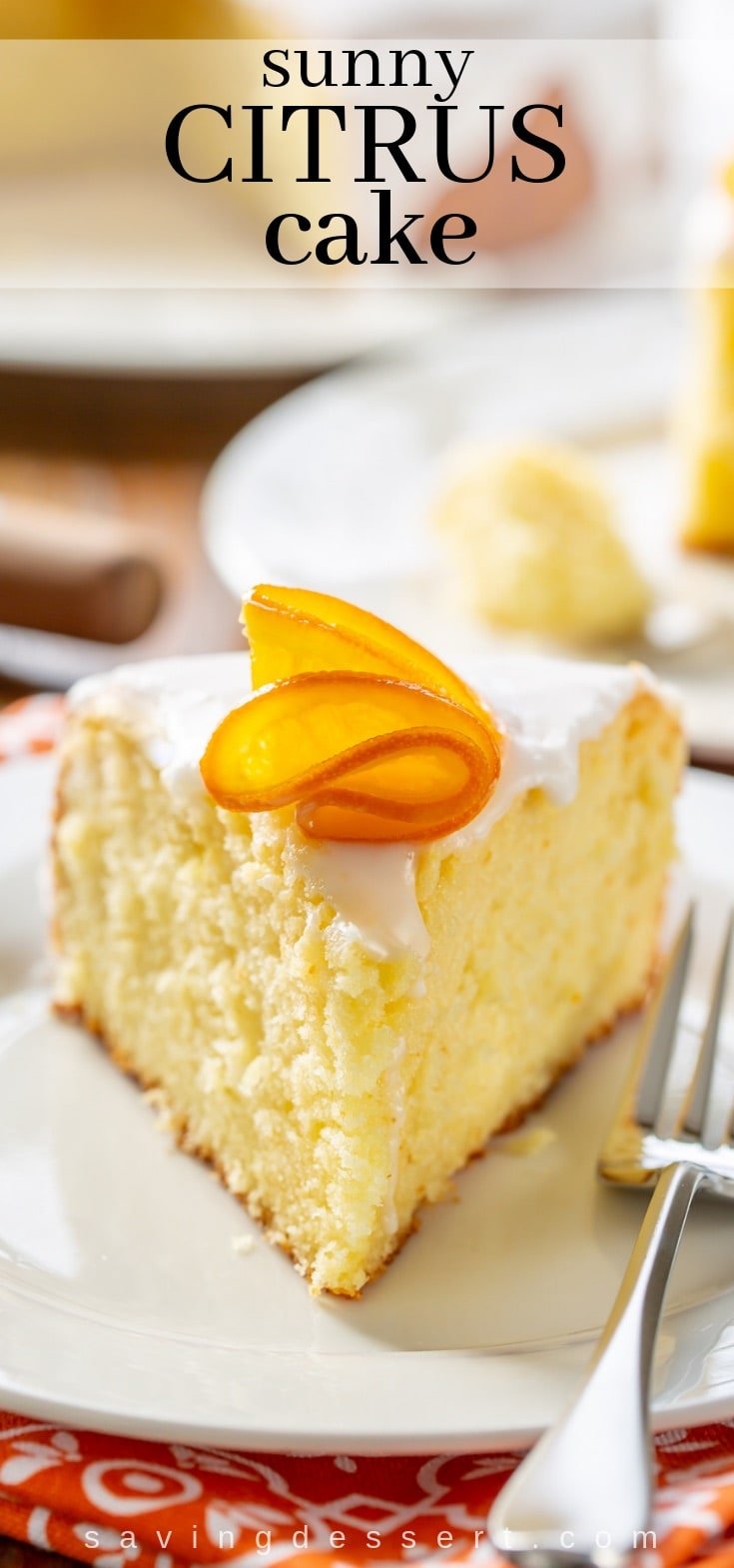 A slice of sunny citrus cake with candied oranges on top