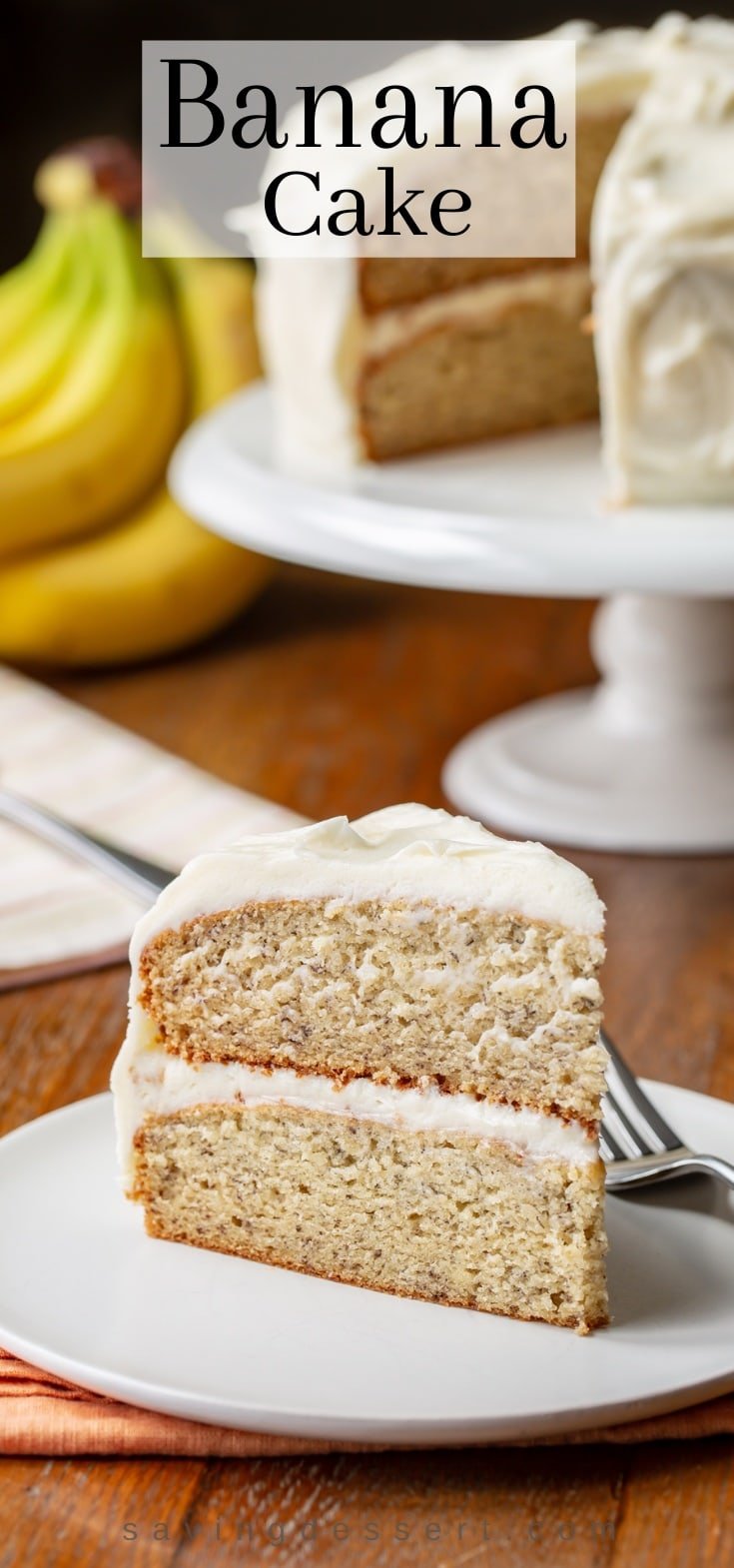 Banana Cake on a cake stand with a slice on a plate