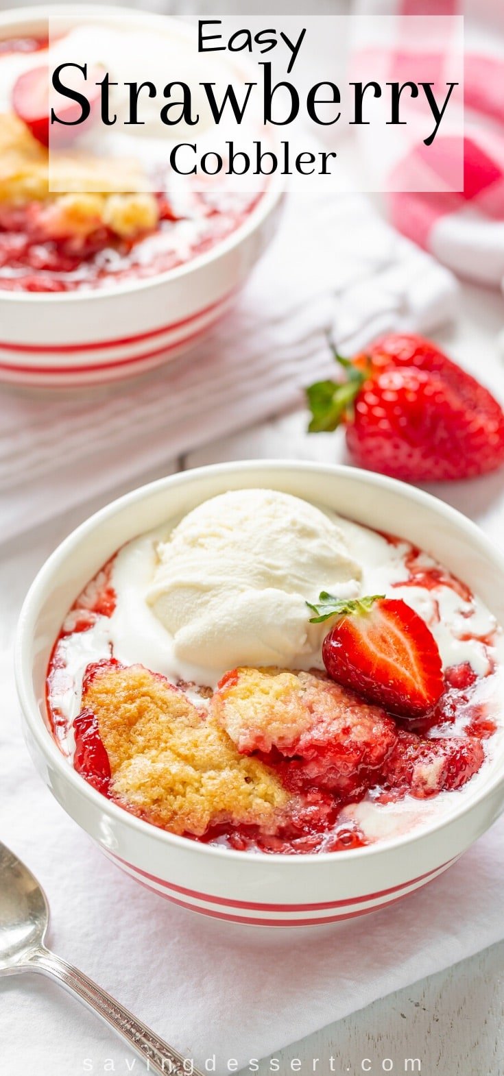 A bowl of strawberry cobbler topped with ice cream
