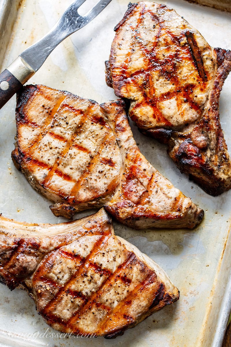 A tray of grilled bone-in pork chops