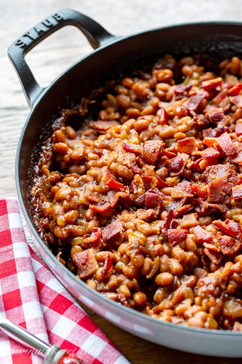 A casserole filled amongst oven baked beans topped amongst crumbled bacon Easy Oven Baked Beans Recipe