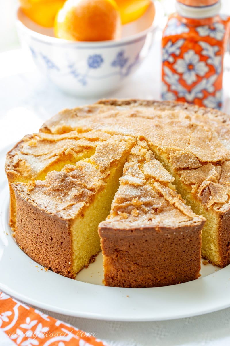 A sliced Orange Olive Oil Cake with a crispy crackly sugar top