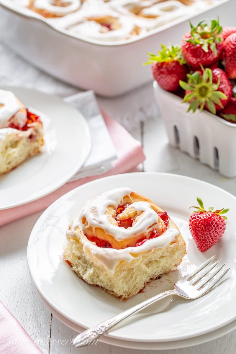 A flaky and soft Strawberry Sweet Roll with fresh strawberries