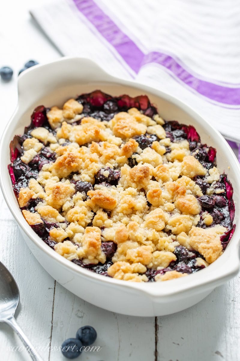A casserole dish filled with a blueberry crisp