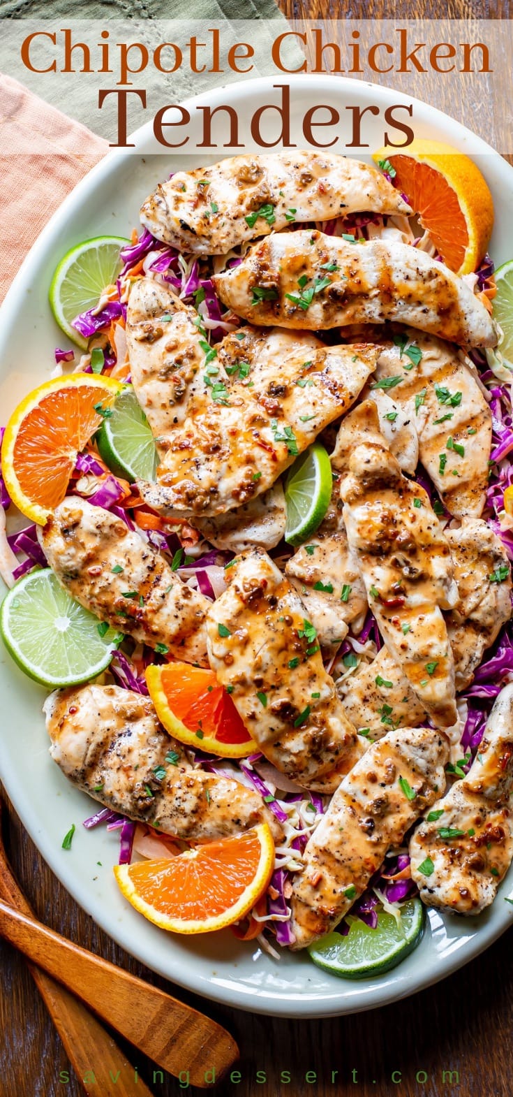 Chipotle chicken tenders with a spicy purple slaw, served with orange and lime wedges