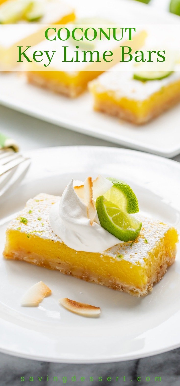 Coconut Key Lime Bars topped with lime wedges, toasted coconut and a dollop whipped cream