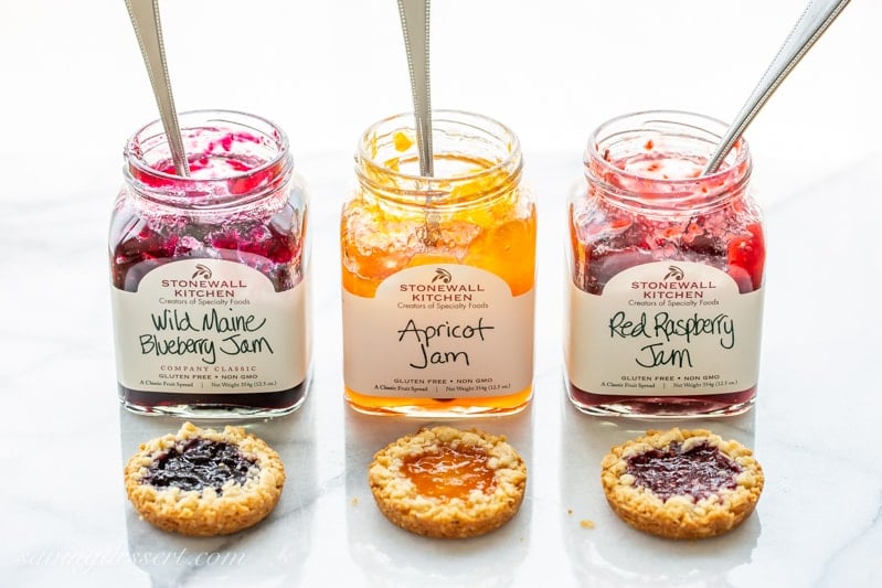 Jars of blueberry, apricot and raspberry jam