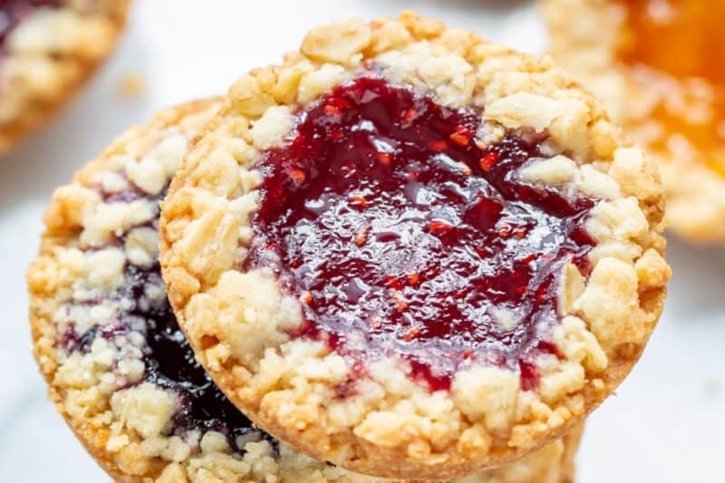 An overhead view of a stack of oatmeal jammy cookies.