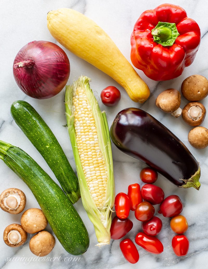 Summer vegetables for grilling: zucchini, mushrooms, onion, bell pepper, eggplant and tomatoes