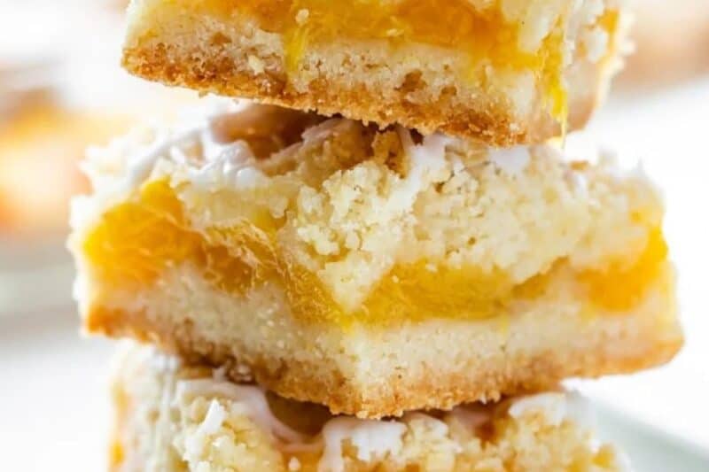 A stack of fresh peach crumb bars.