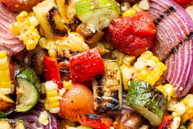 An overhead view of a bowl of chopped grilled vegetables.