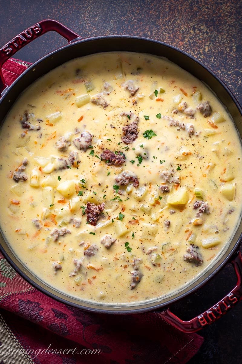 A pot of cheeseburger soup with potatoes