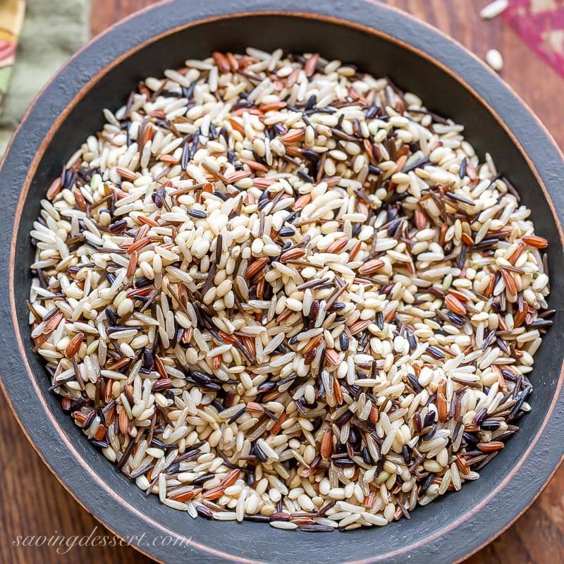 A bowl of uncooked wild rice blend