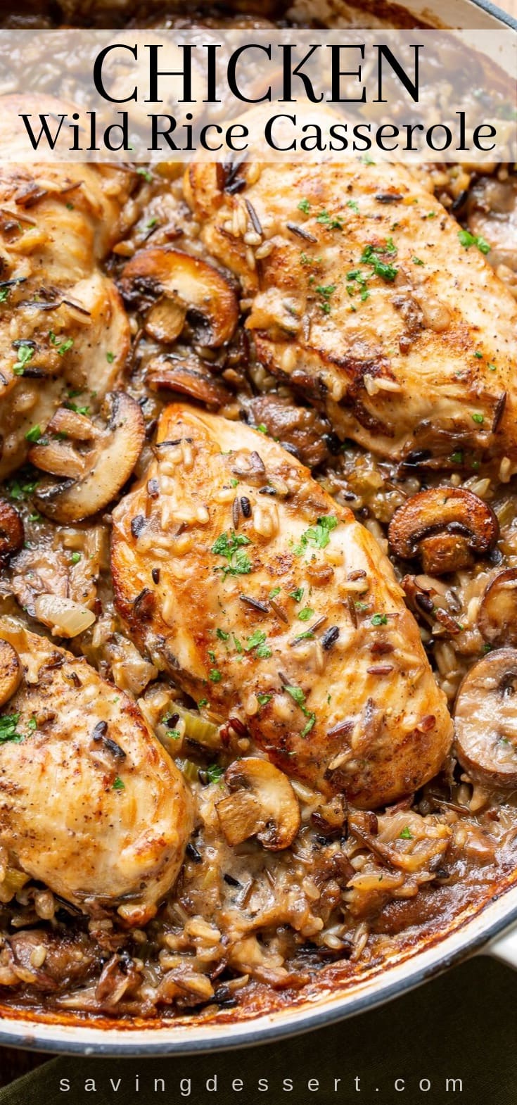 A skillet with chicken and mushrooms in a wild rice casserole