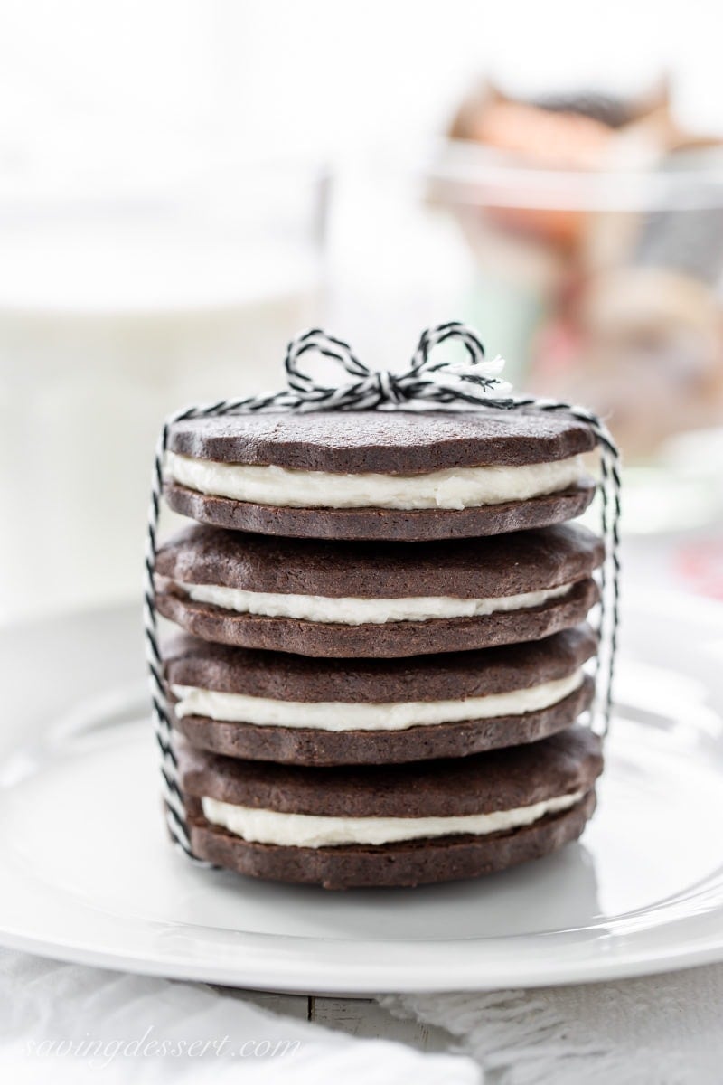 A stack of chocolate sugar cookies sandwiched with a vanilla cream filling 