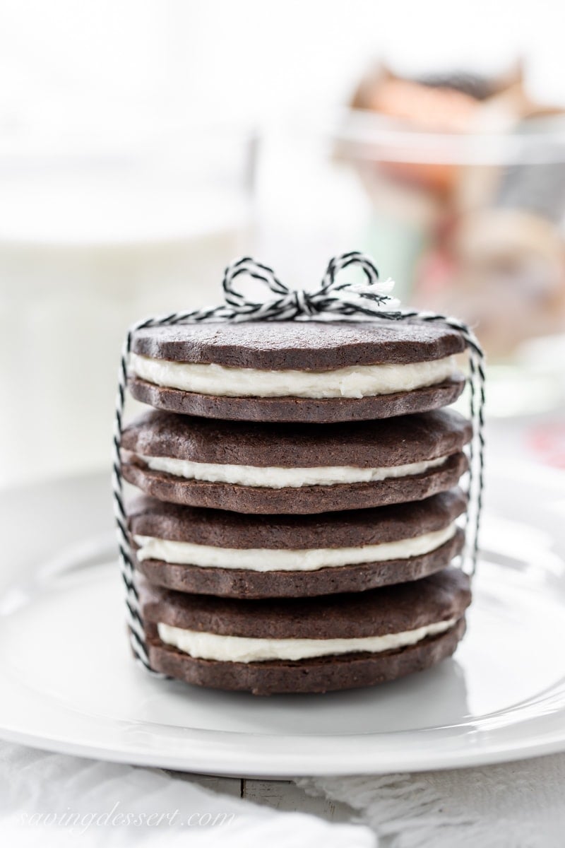 A stack of chocolate sugar cookies with a creamy white filling to look like Oreos