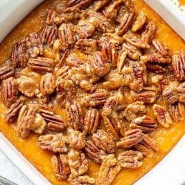 A butternut squash casserole topped with sugared pecans