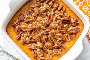 A butternut squash casserole topped with sugared pecans