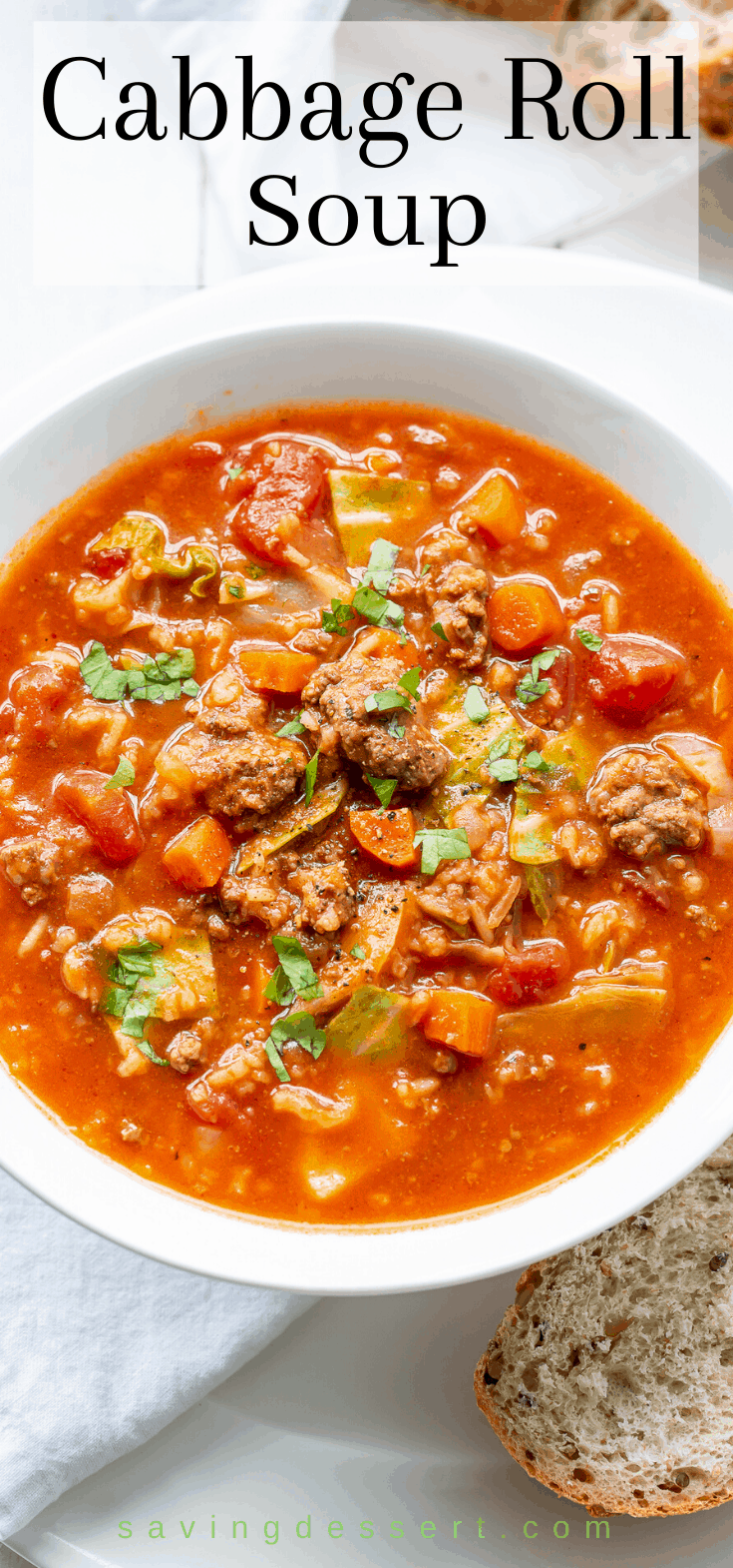 A bowl of cabbage roll soup garnished with parsley