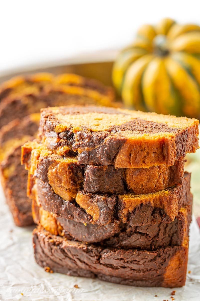 A stack of sliced chocolate marbled pumpkin bread