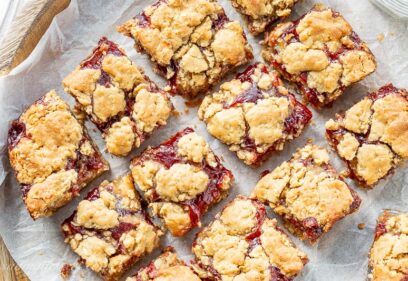 A tray of peanut butter and jelly bars cut into squares