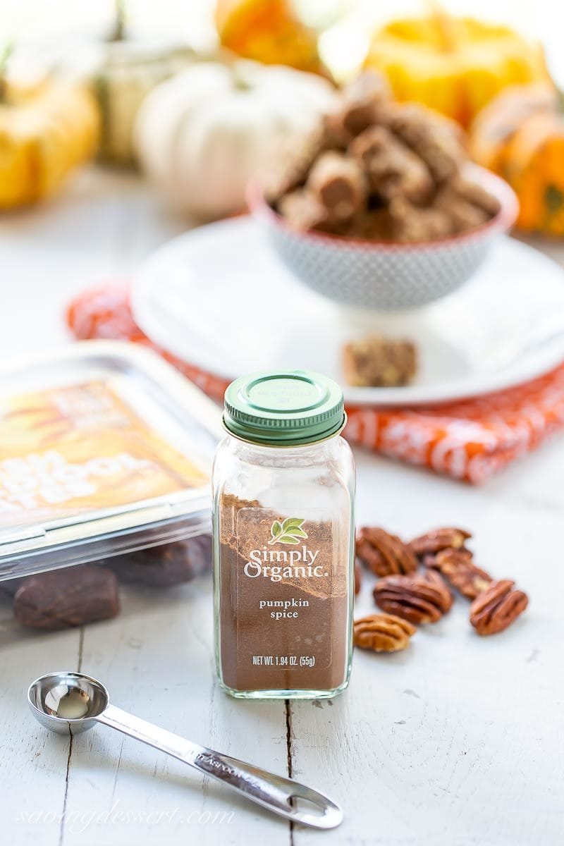 A bottle of pumpkin spice with pecans, Medjool dates and date nut rolls