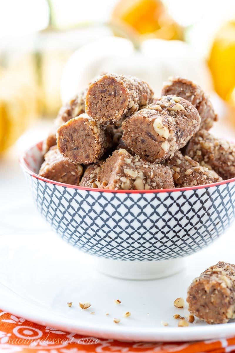 A bowl of pecan covered pumpkin pie spiced date rolls 