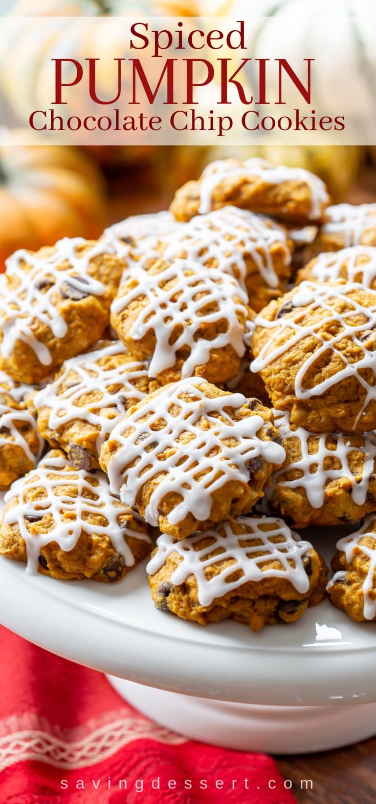 A stack of iced pumpkin chocolate chip cookies