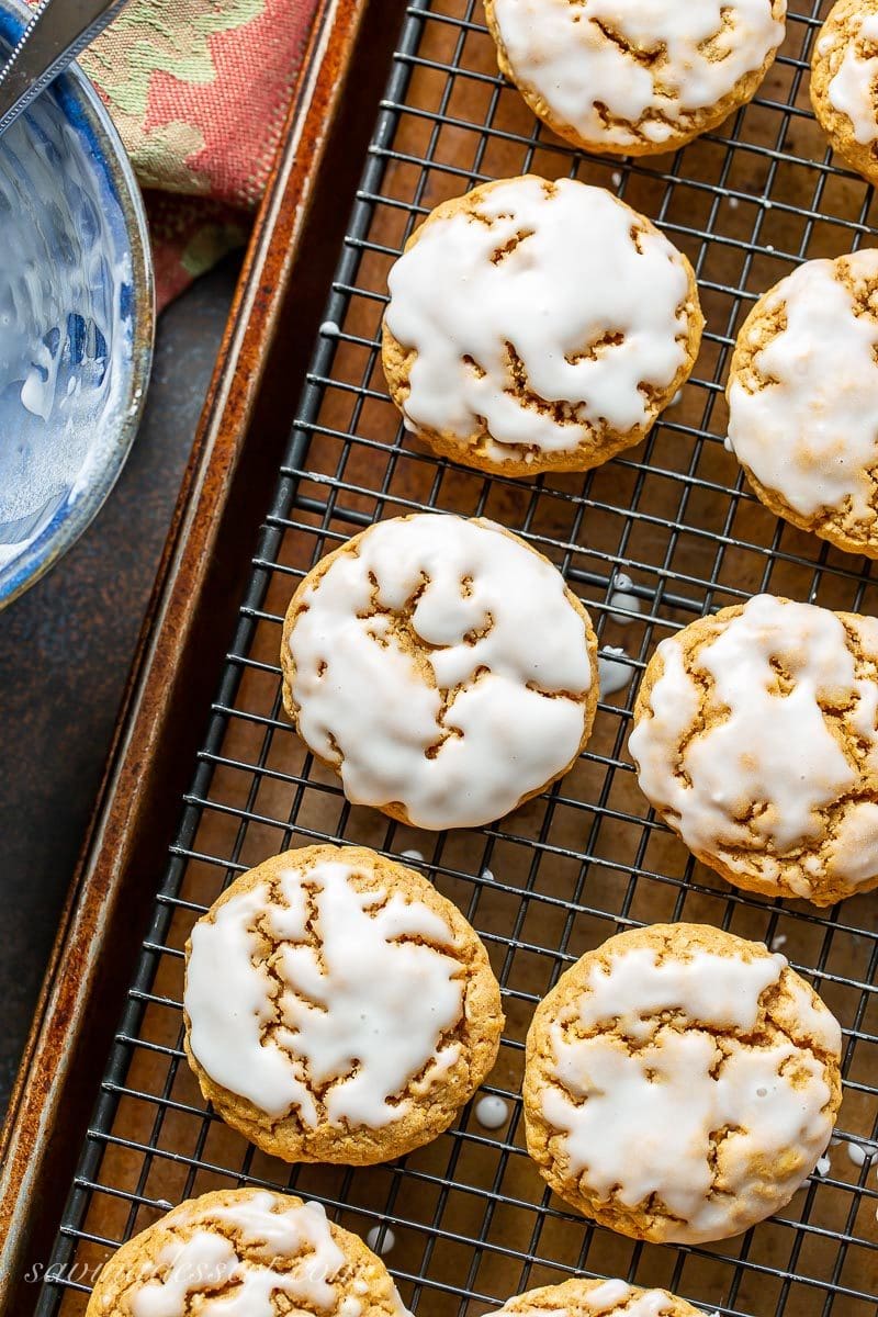 A cooling rack with iced pumpkin oatmeal cookies