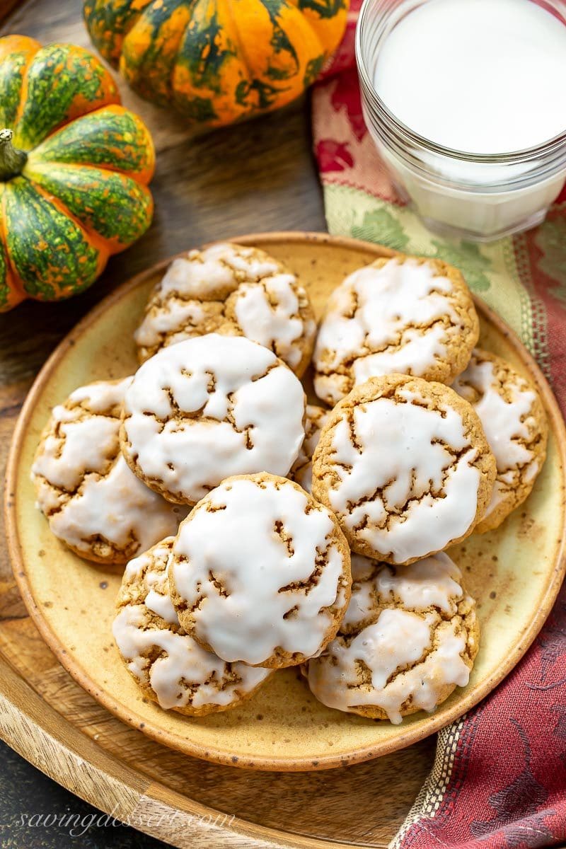 Spiced Pumpkin Oatmeal Cookies on a plate with a glass of milk
