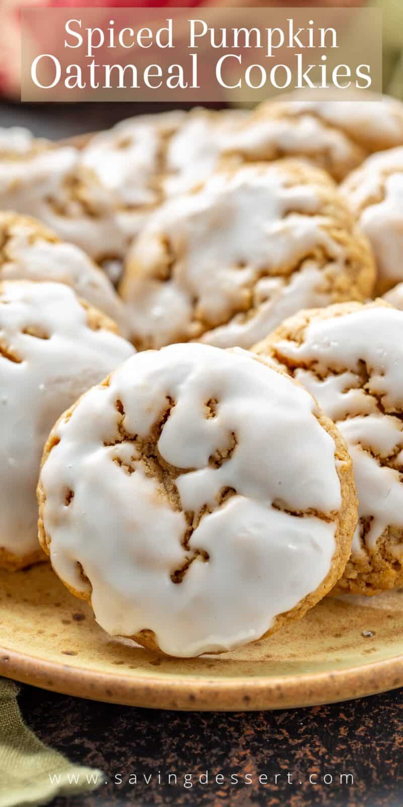 A closeup of a plate of iced oatmeal pumpkin cookies