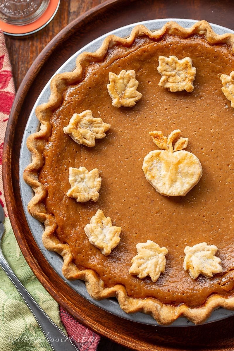 An overhead view of an apple butter pie with crust cookie cutouts on top