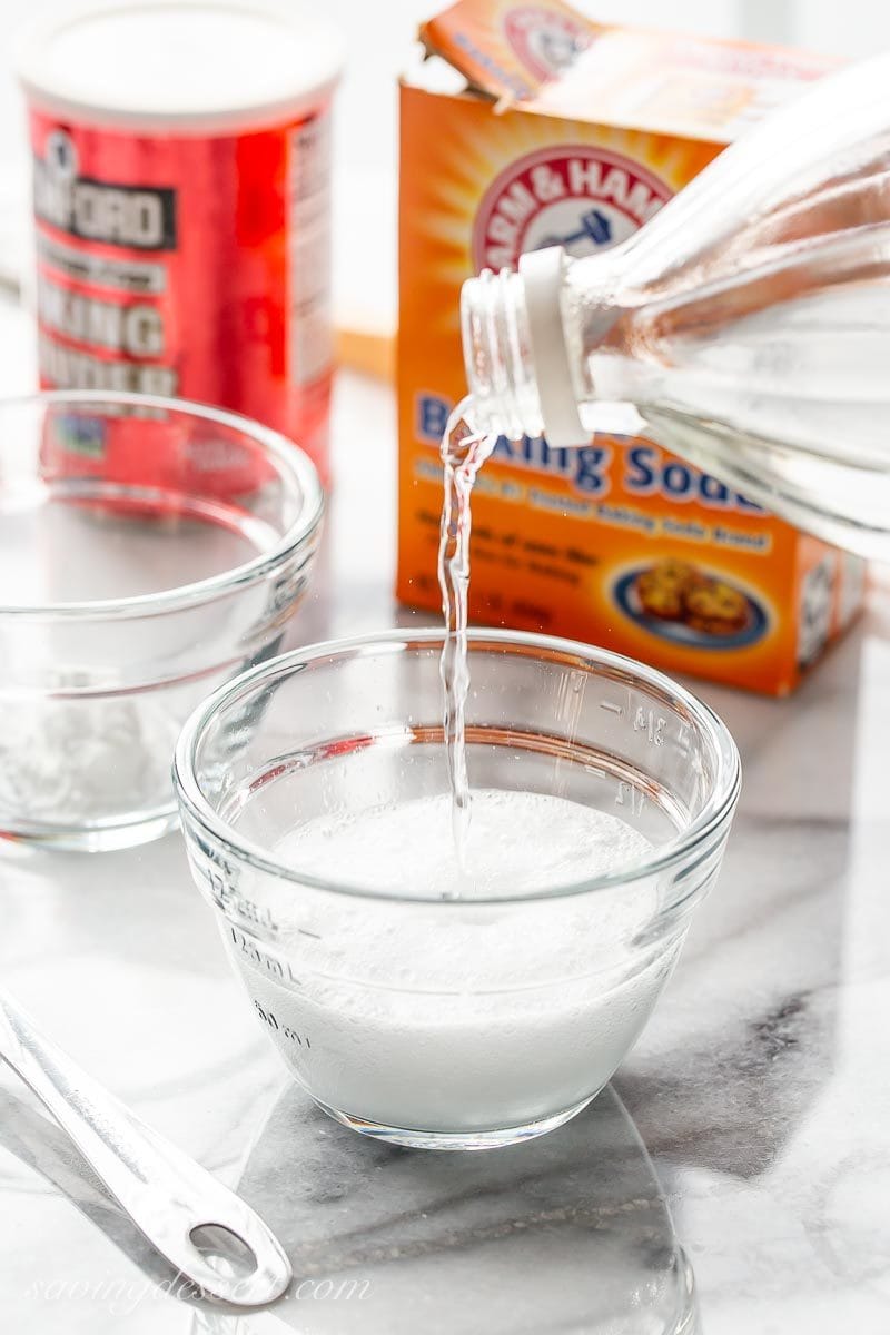 A bowl with baking soda and vinegar bubbling up