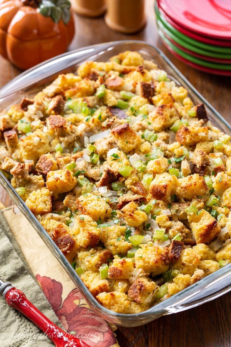 A large pan of homemade Southern cornbread dressing with onions and celery