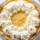 Creamy eggnog pie with swirls of whipped cream and nutmeg