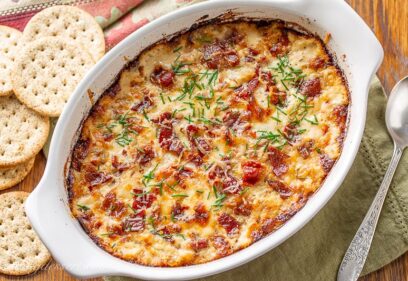 A small casserole dish with hot caramelized onion dip