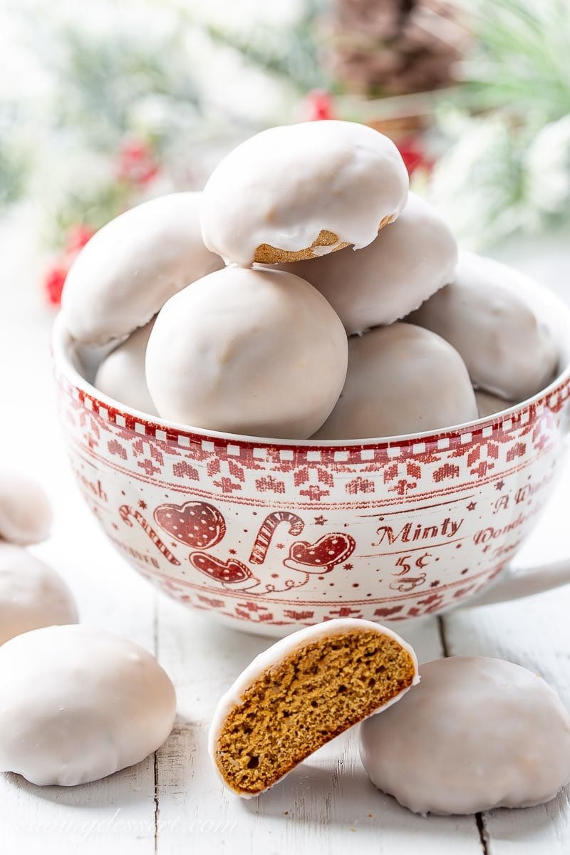 Iced Pfeffernüsse Spice Cookies in a Christmas bowl