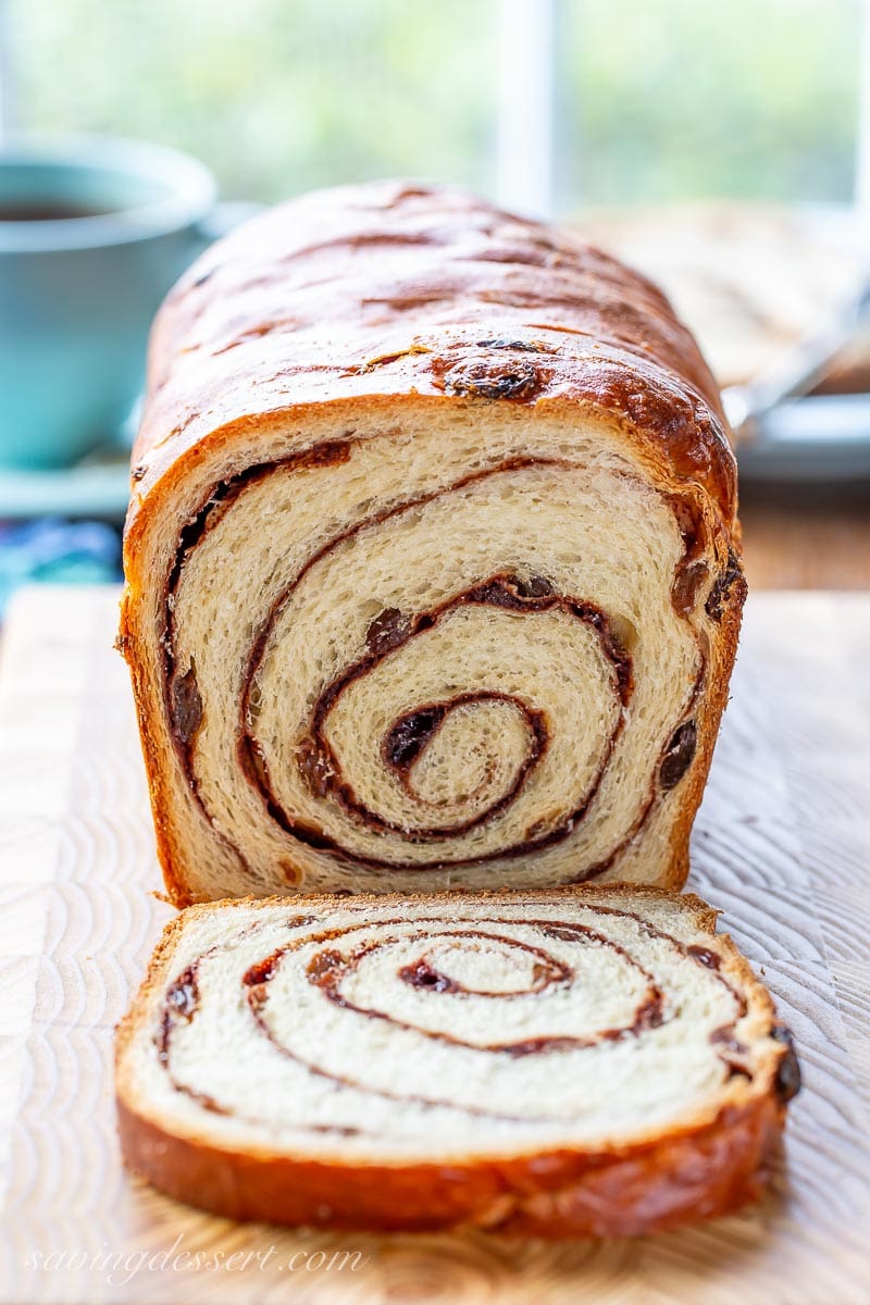 A sliced loaf of cinnamon raisin swirl bread