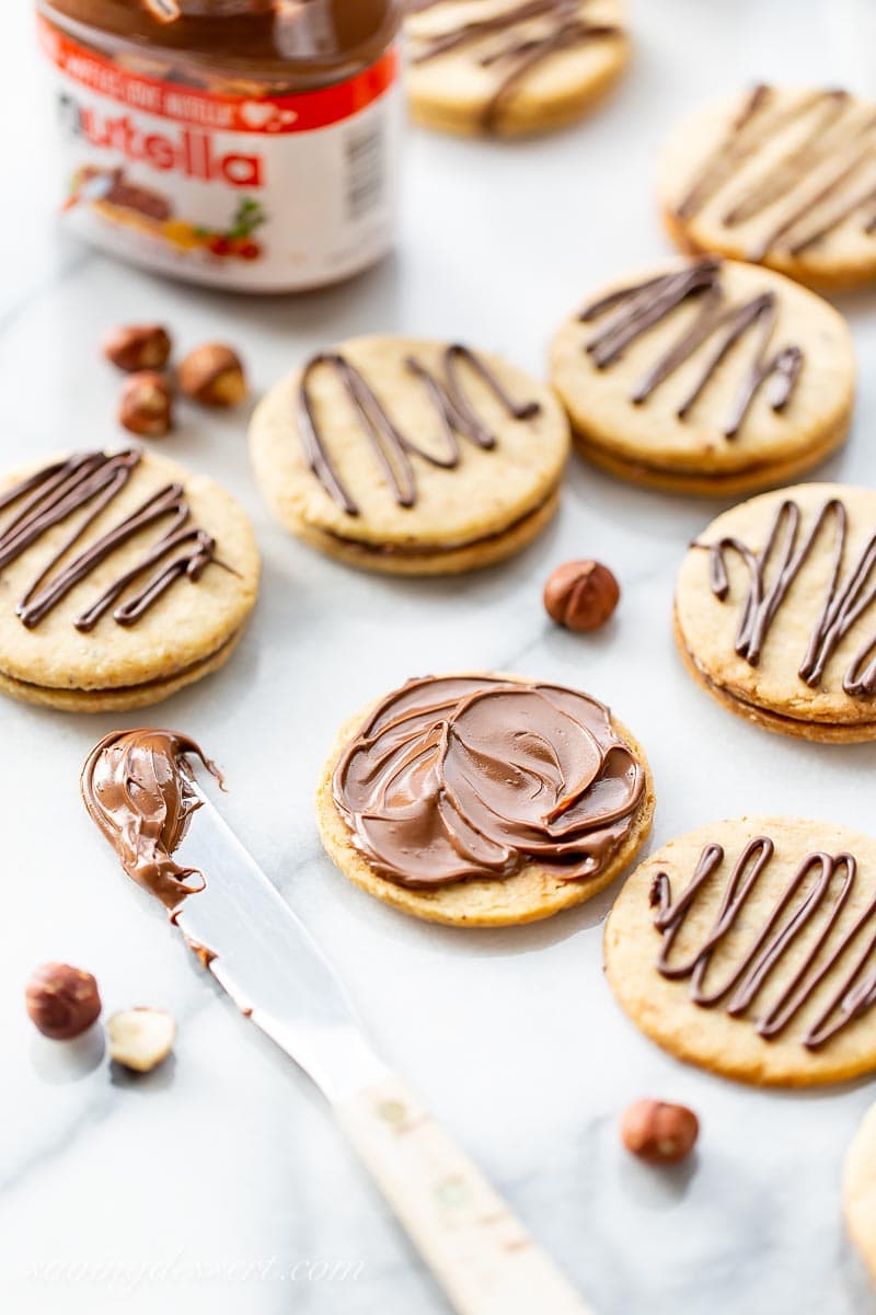 Hazelnut sandwich Nutella Cookies with a chocolate drizzle on top