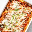 Stuffed Manicotti with sausage and spinach in a casserole dish