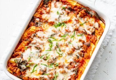 Stuffed Manicotti with sausage and spinach in a casserole dish